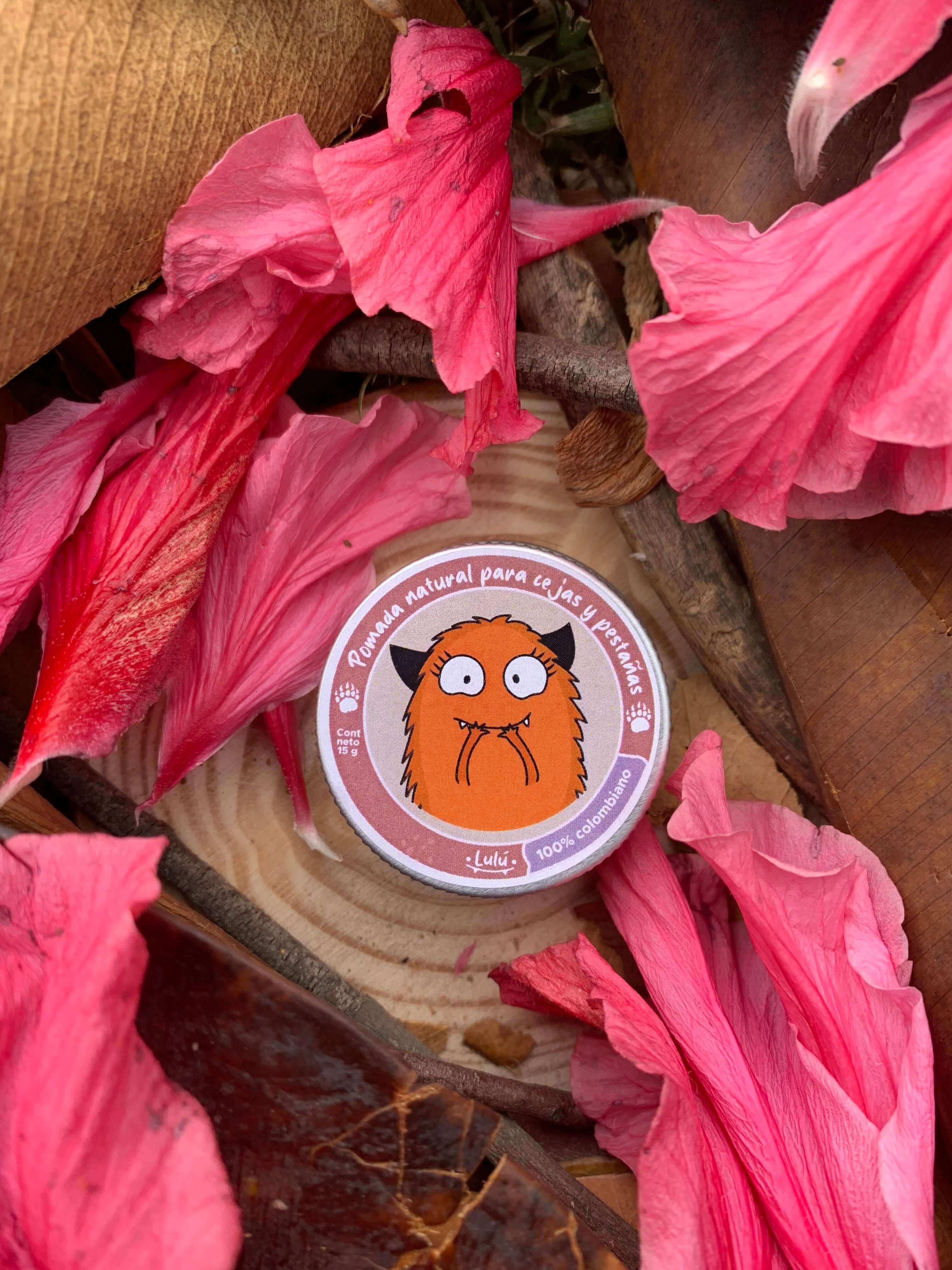 Pomada en tarrito para cejas y pestañas con hojas de color alrededor